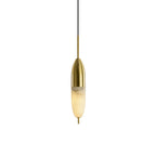 Clérachic Brass Pendant Light on white: tall slim brass cap over a glowing Spanish alabaster shade with a brass tip.