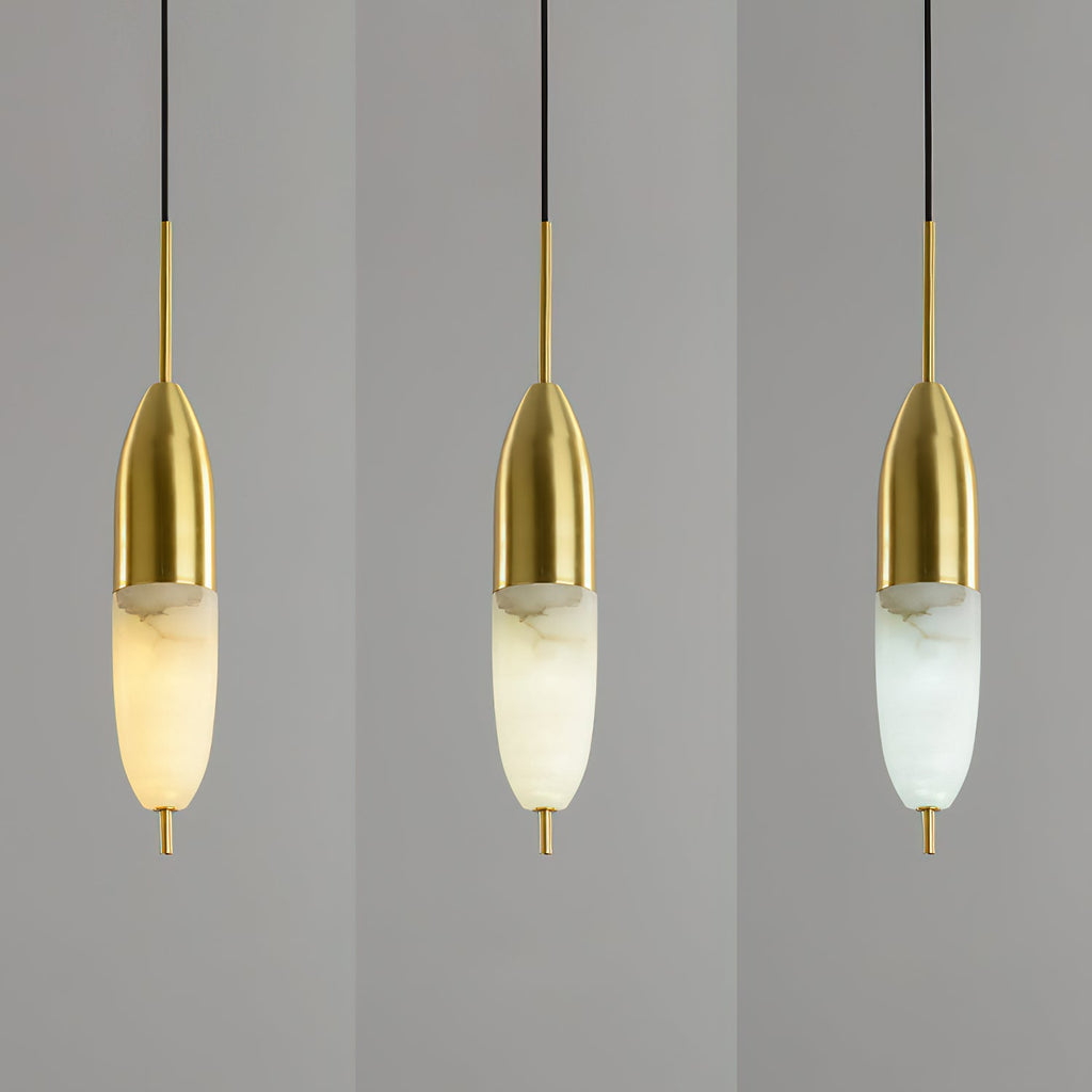 Three slim Clérachic Brass Pendant Lights, LED colour stepping from warm gold through cooler white.