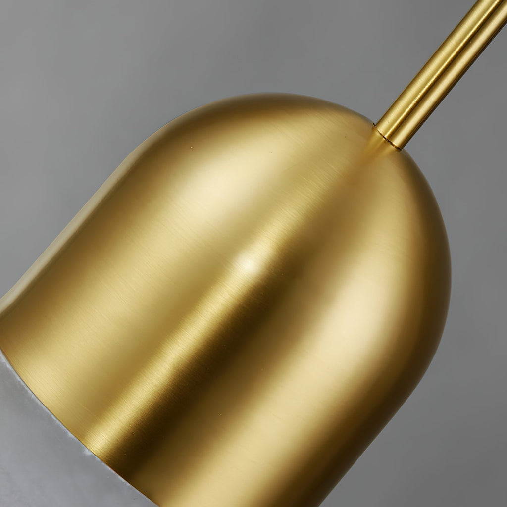 Brushed brass dome and slim stem of the Clérachic Brass Pendant Light, a sliver of alabaster showing at the rim.