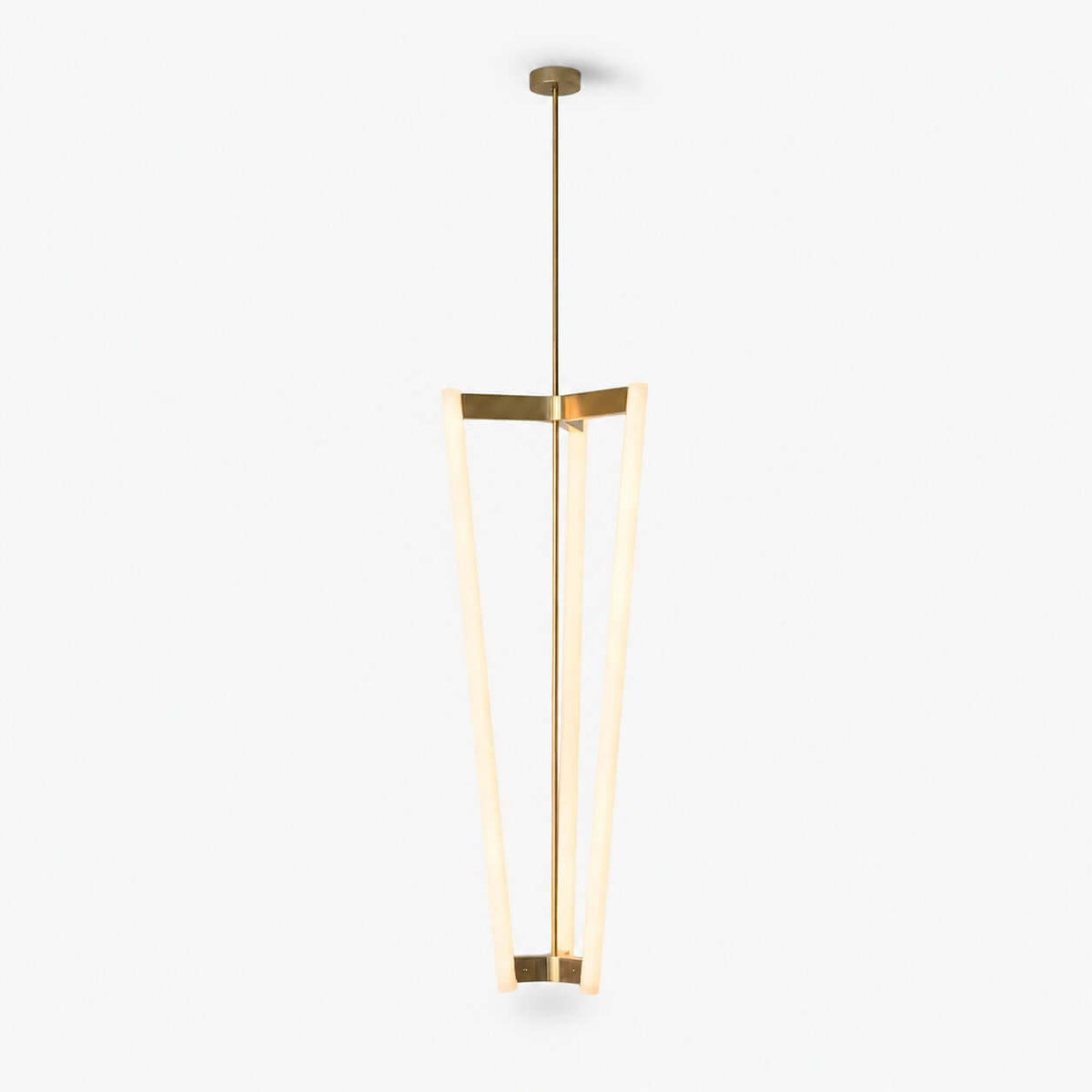 Clérachic pendant light on a plain white backdrop, three slim glowing LED tubes joined by a brass bracket and hung from a brass rod.
