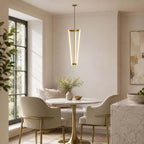 Over a small round marble table by a black-framed window, this Clérachic pendant hangs on a brass rod in a bright breakfast nook.