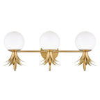 Three-light Clérachic wall light shown with the opal globes above the brass leaf crowns, in a cut-out view on white.