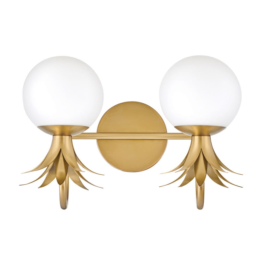 Two-light Clérachic wall light shown with the glass globes above the brass leaf crowns, on a round brass backplate.