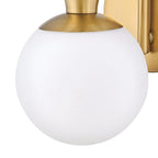 Close view of an opal white glass globe on this Clérachic wall light, with a brass cap and the brass backplate behind it.