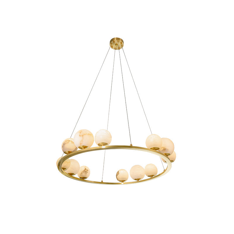 Studio view of the Clérachic alabaster globe chandelier on its wider twelve-light ring, hung from three fine cables and a round brass canopy.