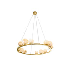 Studio view of the Clérachic alabaster globe chandelier on its wider twelve-light ring, hung from three fine cables and a round brass canopy.