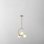 Product shot of the Clérachic brass ring globe pendant in clear glass, three lit globes on a plain grey backdrop showing the short ceiling rod.
