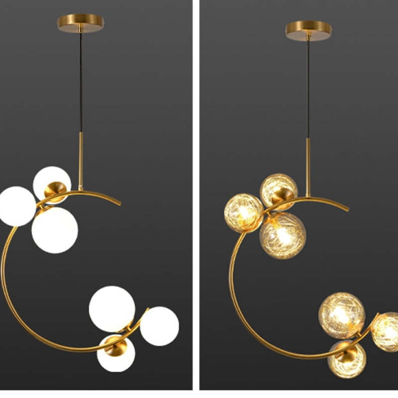 Side-by-side comparison of the Clérachic brass ring globe pendant in milky white glass (left) and clear glass (right).