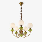 Clérachic Brass Scrollwork Chandelier in green, five lights shown unlit on a plain background with the twisted fabric flex.