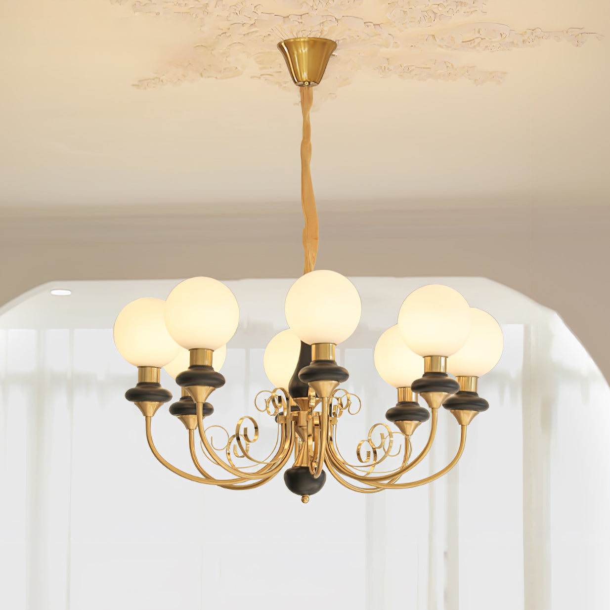 Clérachic Brass Scrollwork Chandelier in black, eight lit opal globes staggered around one ring of curved arms.