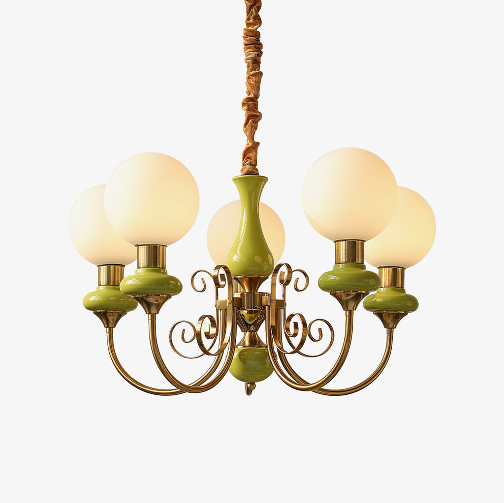 Clérachic Brass Scrollwork Chandelier with apple-green glossy collars, five lit globes on a plain studio backdrop.
