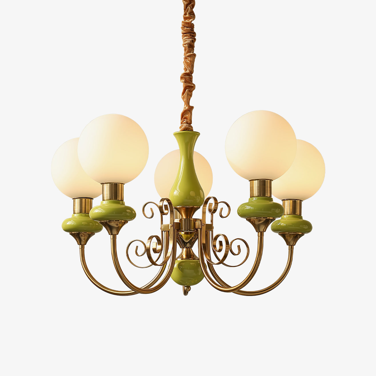 Clérachic Brass Scrollwork Chandelier with apple-green glossy collars, five lit globes on a plain studio backdrop.