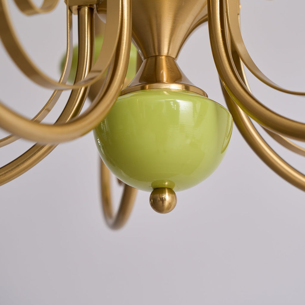 Underside of the Clérachic Brass Scrollwork Chandelier showing the green base cup and the small brass finial ball.