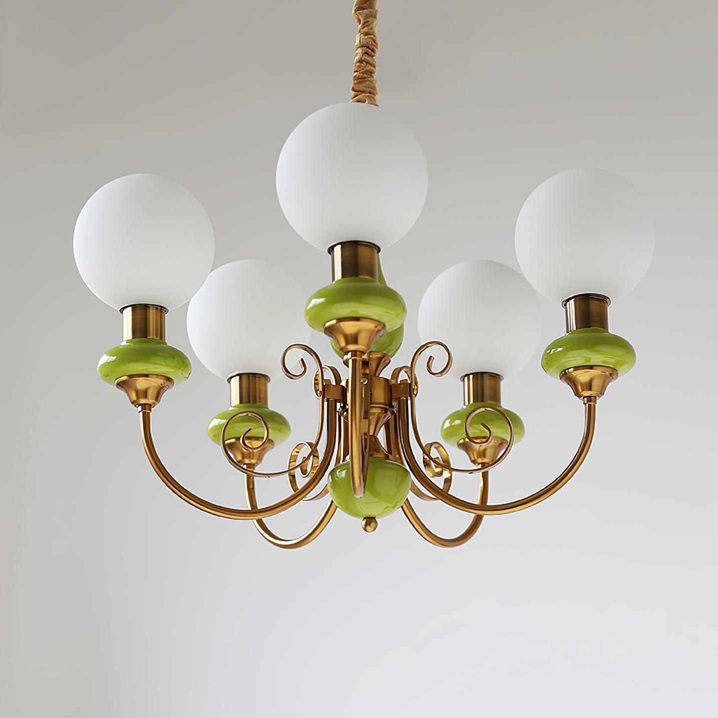 Green Clérachic Brass Scrollwork Chandelier photographed straight on, five opal globes fitted to the flat brass volutes.