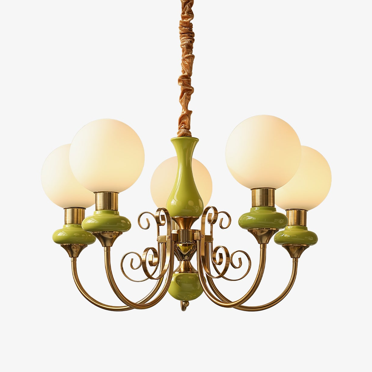 Clérachic Brass Scrollwork Chandelier in green, five lights shown against a soft light backdrop with the flex above.