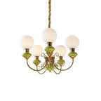 Small studio view of the green Clérachic Brass Scrollwork Chandelier, five globes and the twisted fabric flex on white.