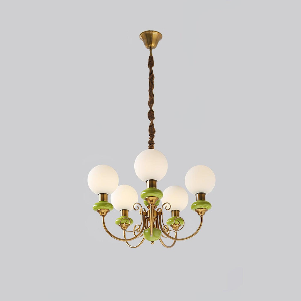 Green Clérachic Brass Scrollwork Chandelier at full drop on grey, brass canopy above five lit opal globes.