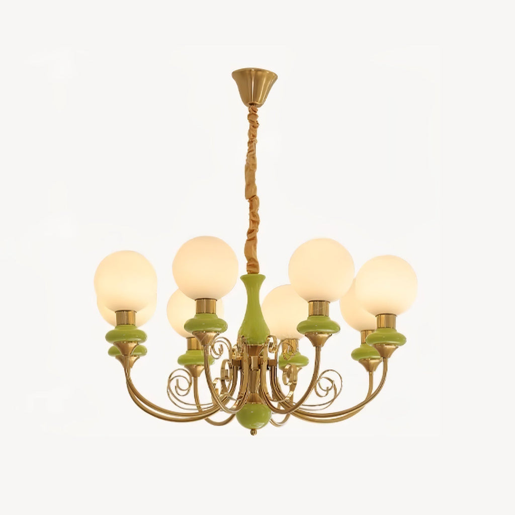 Eight-light Clérachic Brass Scrollwork Chandelier in green, arms staggered around one ring on an off-white backdrop.