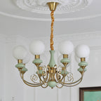 Sage-green Clérachic Brass Scrollwork Chandelier in the eight-light size, lit beneath a carved plaster medallion.