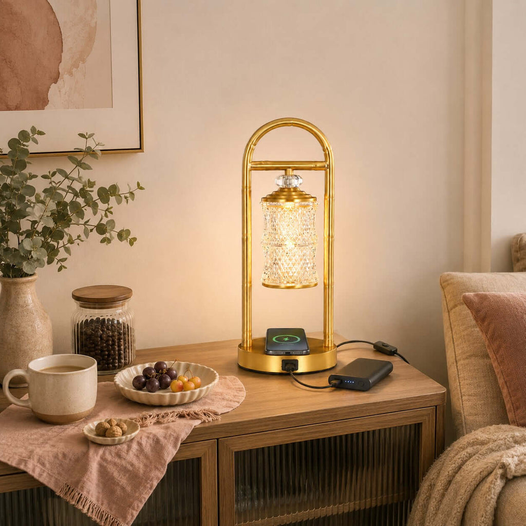Clérachic table lamp on a wooden console, a phone on its charging pad and a power bank beside it, with a bowl of grapes.