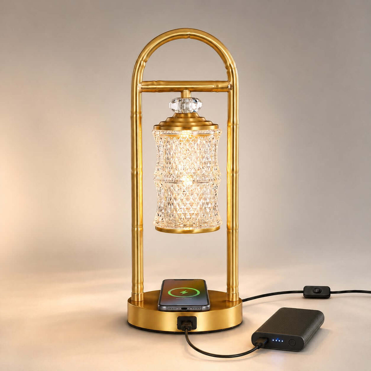 Clérachic table lamp with a phone on its wireless charging pad and a power bank plugged into the USB port on the base.