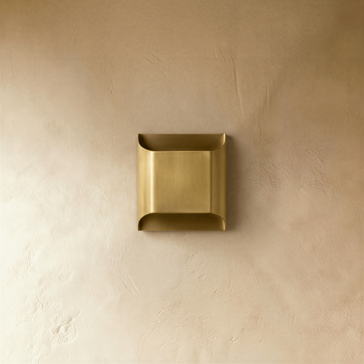 Clérachic antiqued brushed brass wall light switched off, a clean rectangular profile with softly curved top and bottom lips.