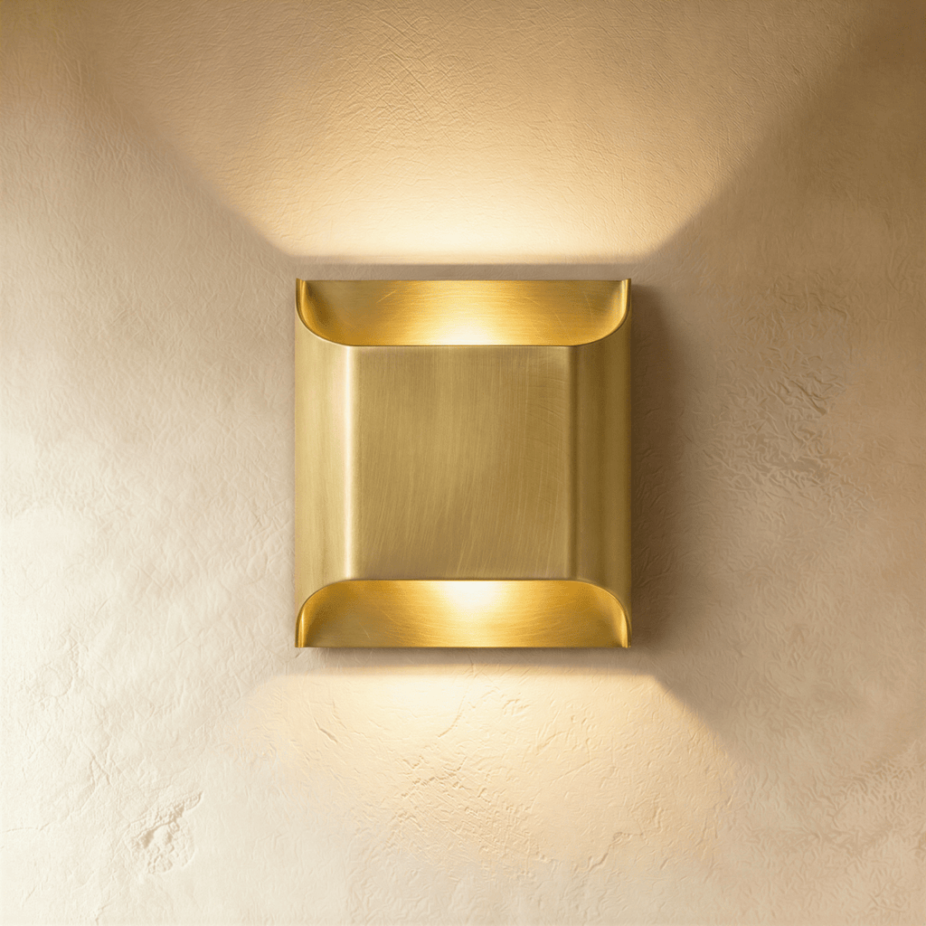 Clérachic largest square brass wall light with rolled edges, warm up and down light washing over limewash.