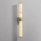 The brass wall plate behind the band is visible on this Clérachic alabaster tube light, against a pale grey wall.