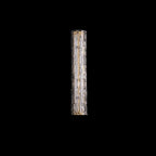 Clérachic wall light shown on a black backdrop, switched off, with its clear faceted glass and gold frame visible.