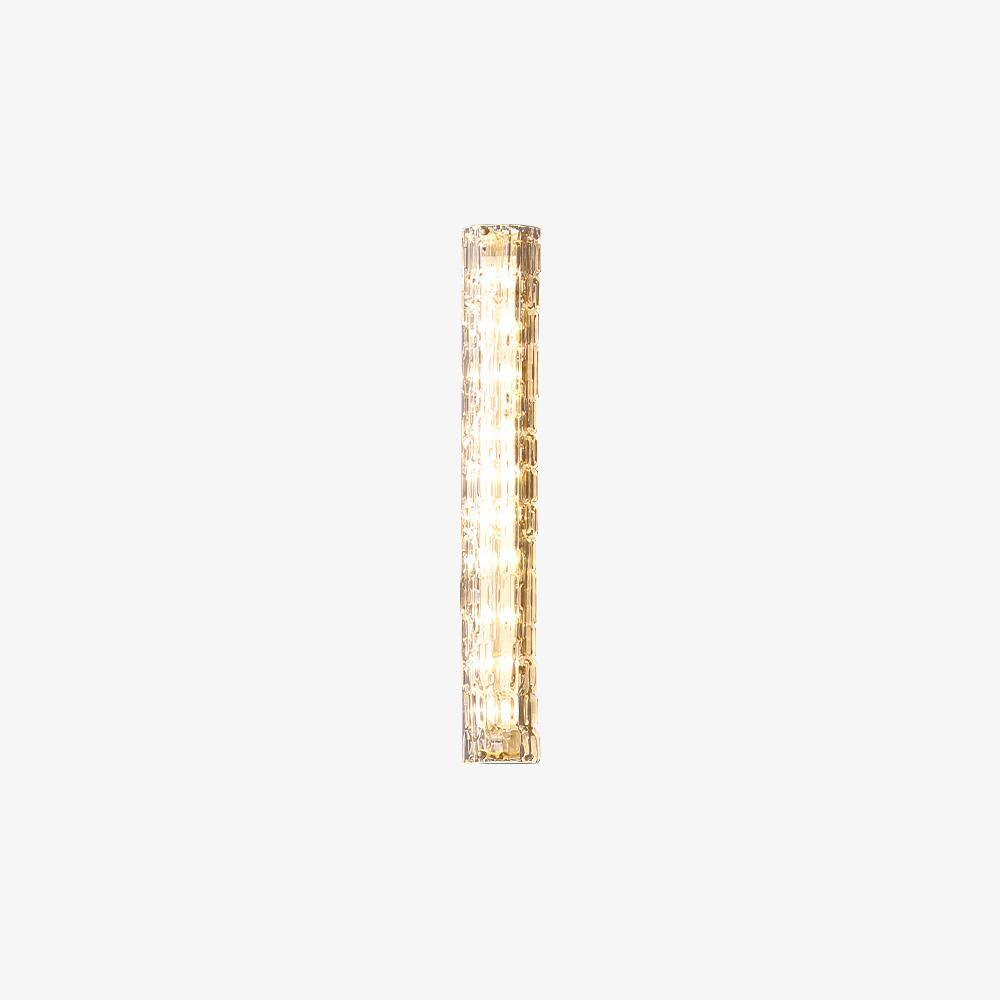 Small view of a Clérachic wall light on a white backdrop, its clear glass shade and gold frame lit from inside.