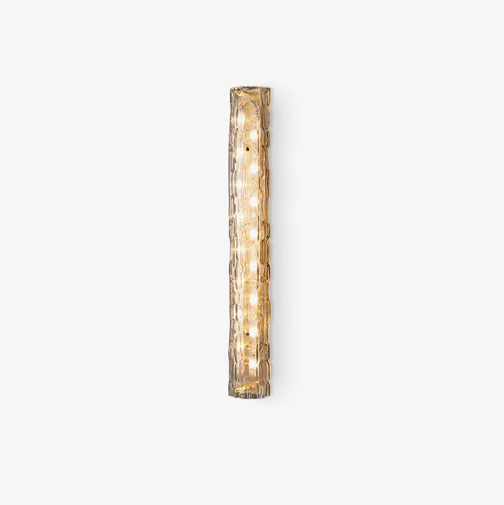 Unlit Clérachic wall light on a pale grey backdrop, with its rippled glass and gold backplate visible.