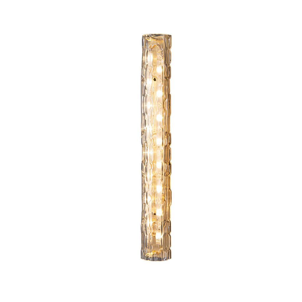 Lit Clérachic wall light on white, with a column of warm LEDs behind the rippled clear glass.