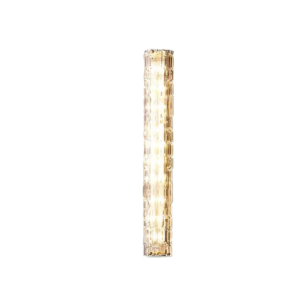 Lit Clérachic wall light on a plain white backdrop, with clear rippled glass and gold ends.