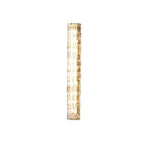 Lit Clérachic wall light on a plain white backdrop, with clear rippled glass and gold ends.