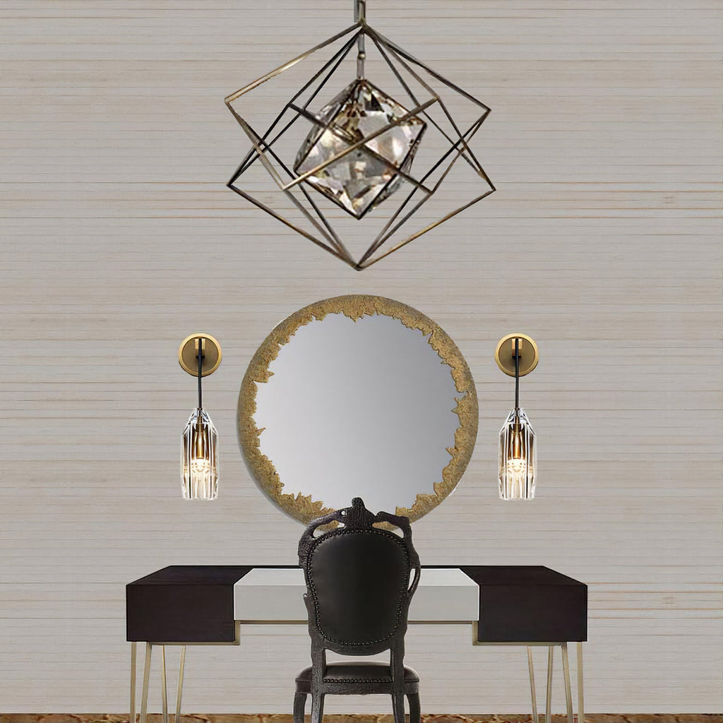 A pair of these Clérachic wall lights either side of a round gold-edged mirror above a black dressing table, under a geometric cage pendant.