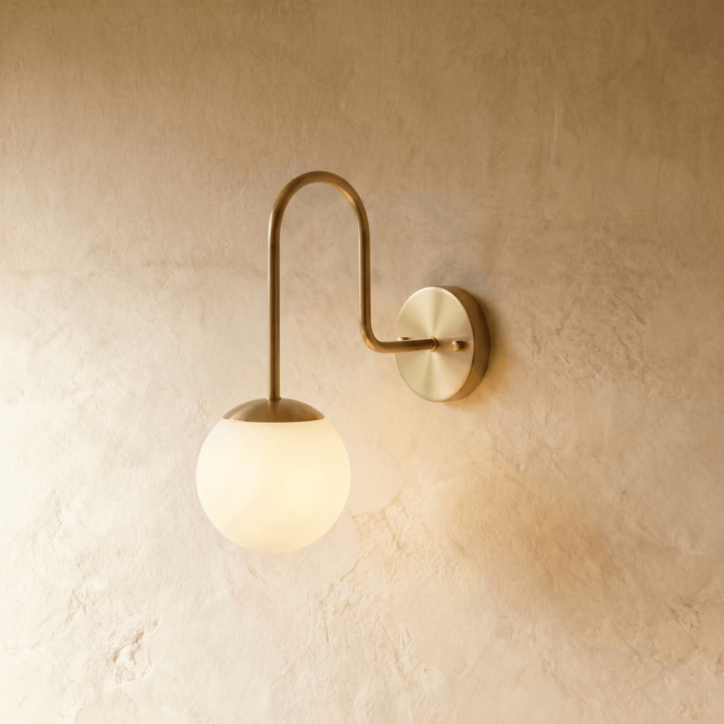 Clérachic wall lamp in chrome, a frosted glass globe suspended beneath a curved gooseneck arm.