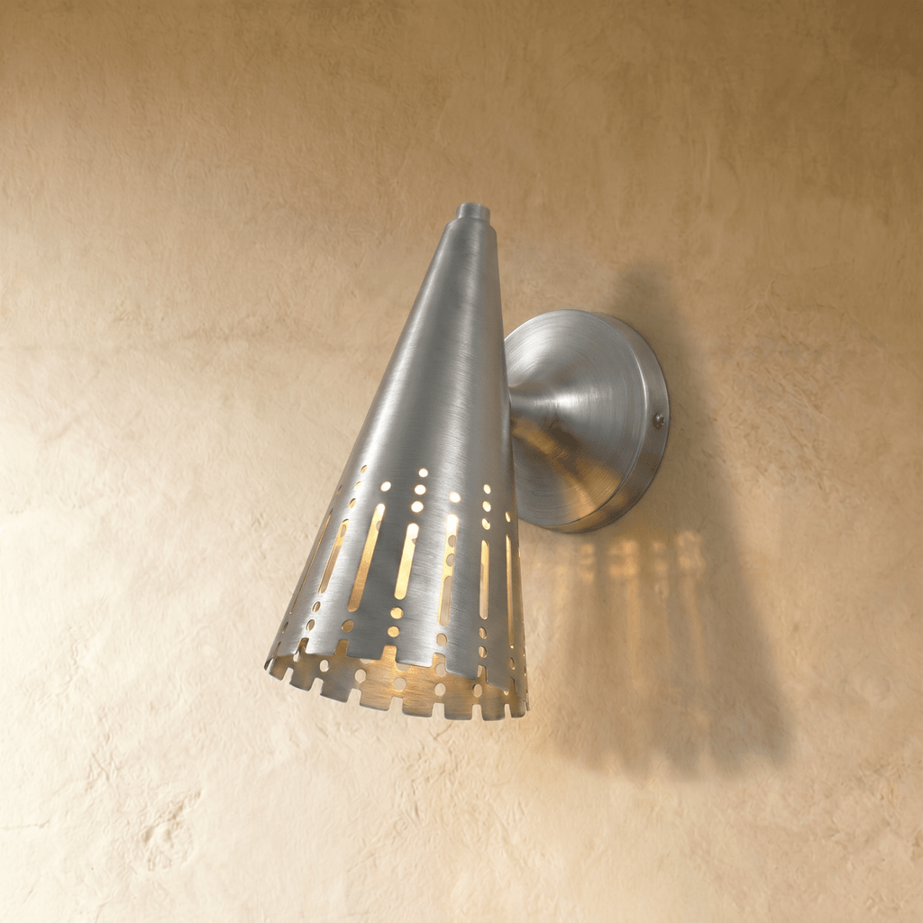 Clérachic wall lamp in chrome, the polished cone shade and dome mount reflecting a cool metallic sheen.