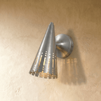 Clérachic wall lamp in chrome, the polished cone shade and dome mount reflecting a cool metallic sheen.