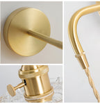 Three close views of this Clérachic wall light: the round brass backplate, the knurled brass socket and the arm with twisted cord.