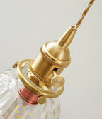 Close view of the brass socket, knurled collar and twisted cord at the top of this Clérachic wall light.