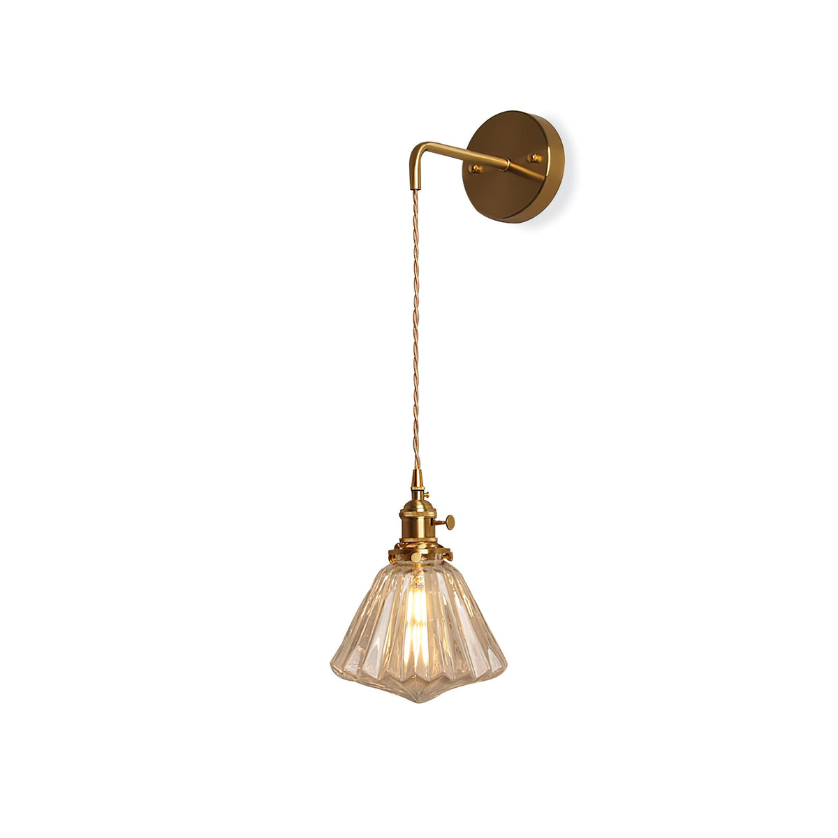 A Clérachic wall light on white, showing the round brass backplate, curved arm, braided cord and ribbed amber-tinted shade.