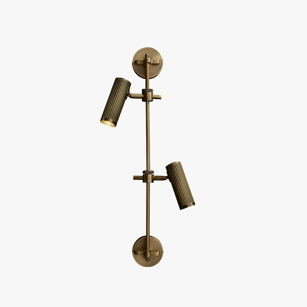 Two-head bronze wall light from Clérachic with both heads angled down, on a light grey backdrop.