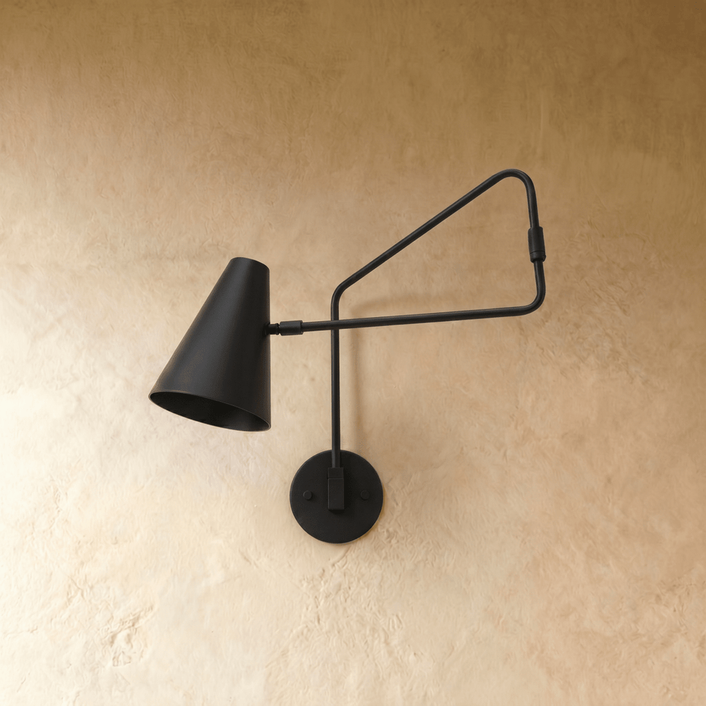 Clérachic wall lamp in matte black shown from another angle, the swing arm extended from the wall.