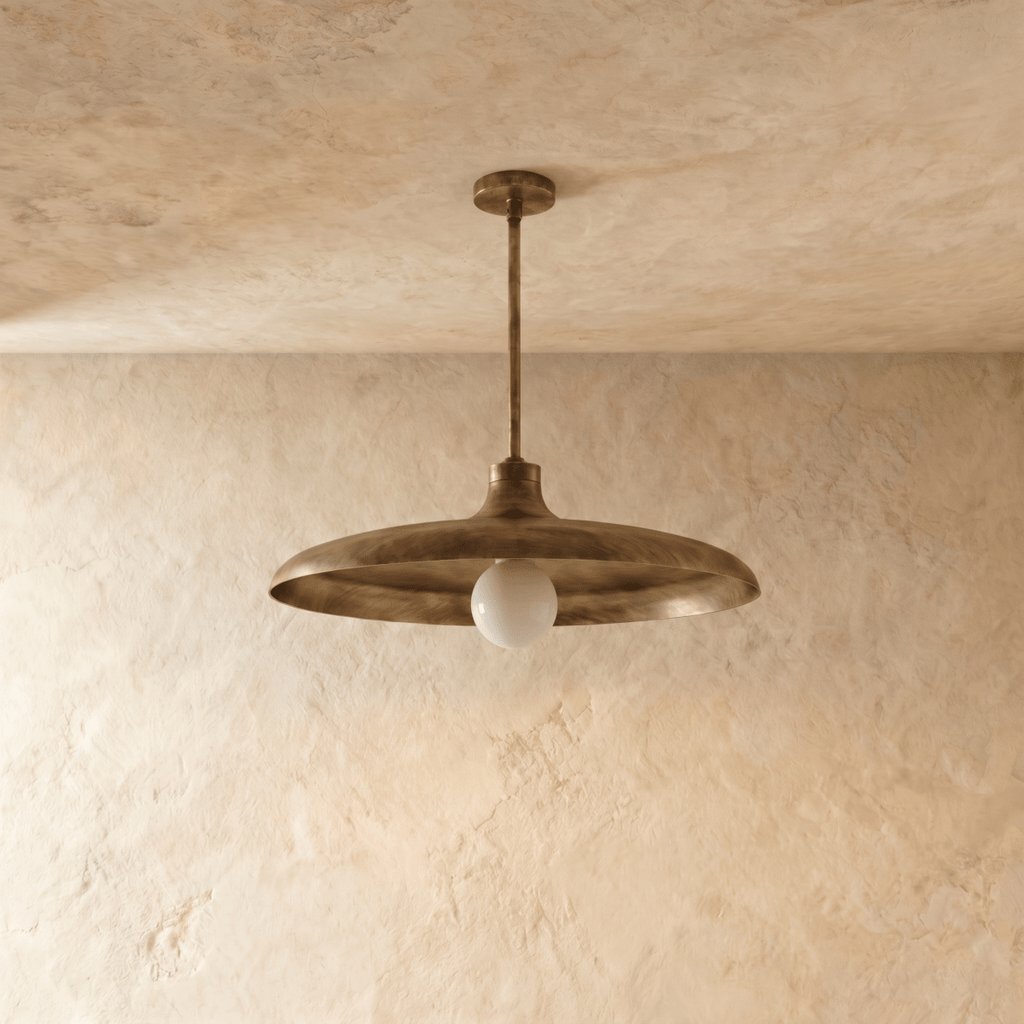 Clérachic pendant light in vintage brass, the disc shade and drop rod viewed from a slightly different angle.