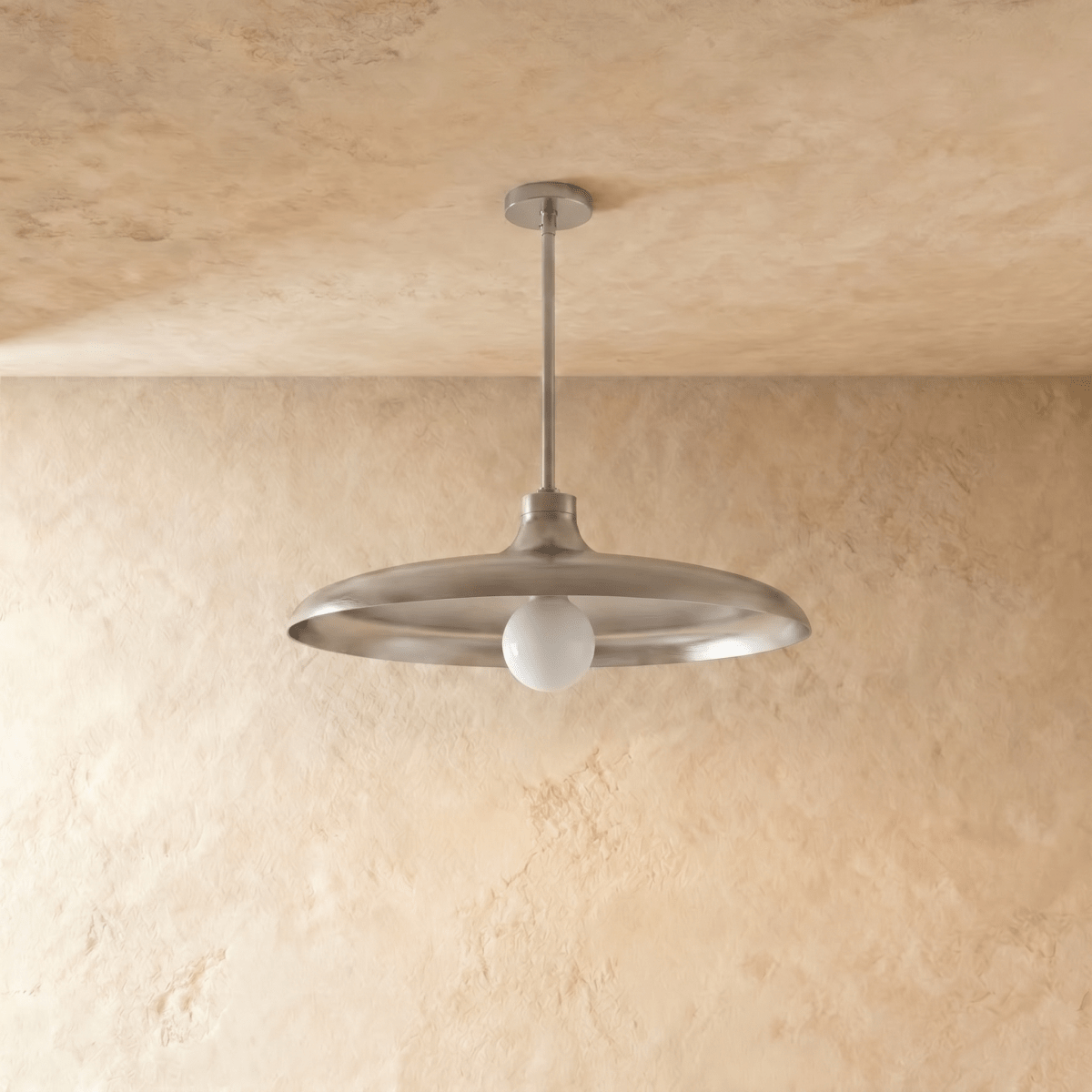 Clérachic pendant light in chrome, the disc shade and drop rod viewed from a slightly different angle.