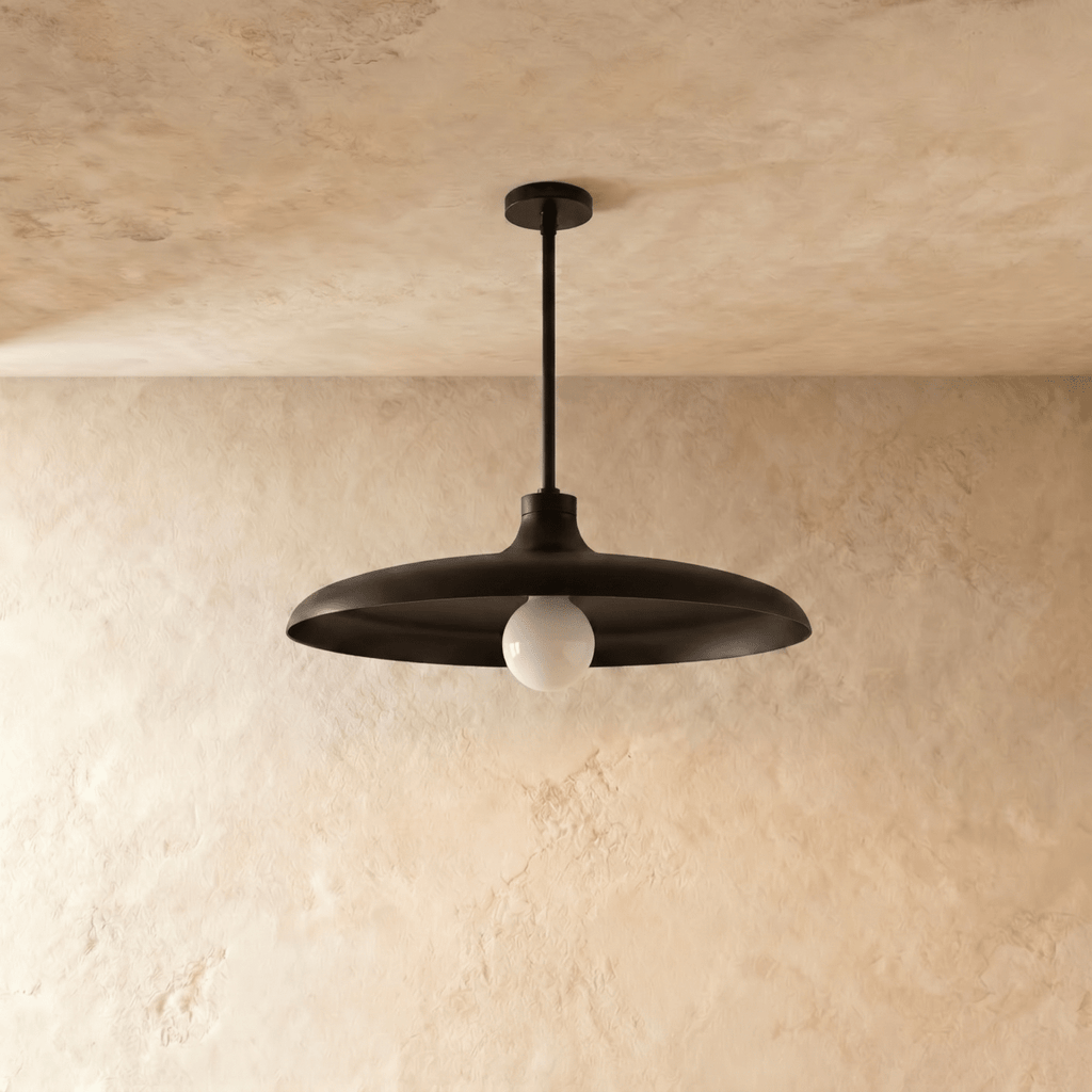 Clérachic pendant light in matte black, the disc shade and drop rod shown from another angle.
