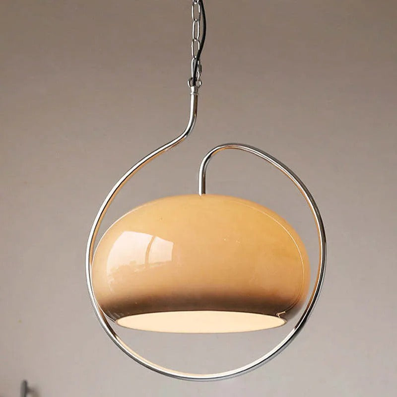 Clérachic beige mushroom-glass pendant in a circular chrome frame, open at the bottom with a warm glow.