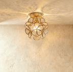 Clérachic flower ceiling light in clear glass petals with an embossed floral pattern, glowing bright and warm.