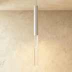 Clérachic white pendant light with the longest bubble acrylic shade, casting a warm glow on a limewash wall.