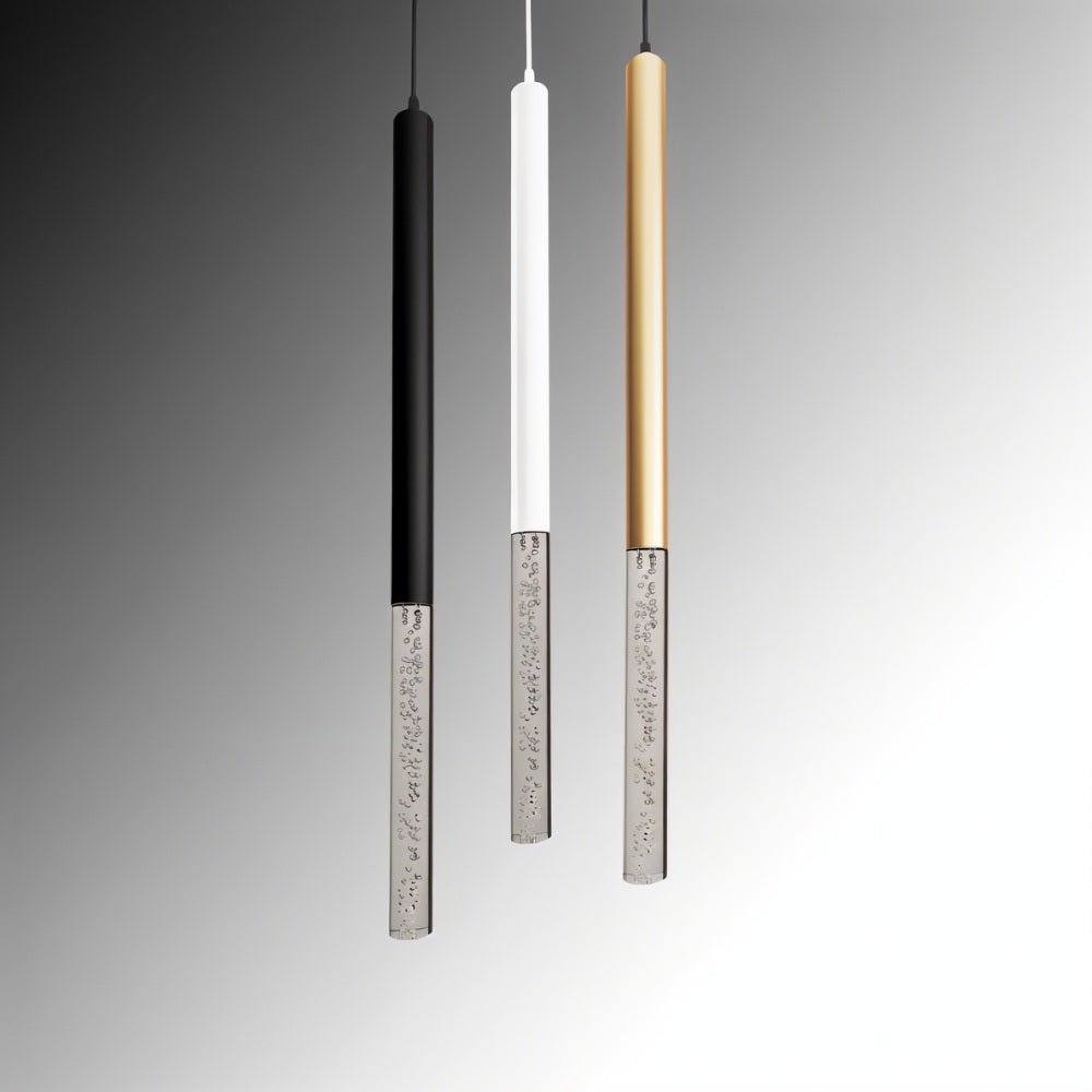Clérachic bubble acrylic pendants in black, white and gold, hanging side by side against a grey studio backdrop.